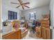 Bedroom with boxes and miscellaneous items, tile floor, ceiling fan, and window at 12877 Palm Dr, Largo, FL 33774