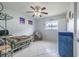 Bedroom with a ceiling fan, neutral walls, tile floors, and a single bed at 12877 Palm Dr, Largo, FL 33774