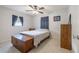 Bedroom featuring neutral walls, tile flooring, a window, and simple decor at 12877 Palm Dr, Largo, FL 33774