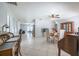 An open concept floor plan shows the dining area and multiple living spaces at 12877 Palm Dr, Largo, FL 33774
