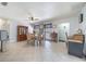 Open dining area filled with natural light and neutral colors with tile flooring at 12877 Palm Dr, Largo, FL 33774