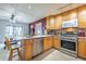 Open kitchen with stainless appliances flowing into the dining and living areas at 12877 Palm Dr, Largo, FL 33774