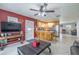 Spacious living area with tile flooring adjacent to a well-equipped kitchen and dining area at 12877 Palm Dr, Largo, FL 33774