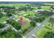 Inviting single-story home with a green lawn, nestled in a peaceful neighborhood close to open fields at 13102 Done Groven Dr, Dover, FL 33527
