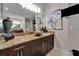 Bathroom features a vessel sink atop a granite countertop and dark wood cabinetry at 13102 Done Groven Dr, Dover, FL 33527