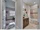 Elegant bathroom featuring a vanity with granite countertops and a bathtub with tile surround at 13102 Done Groven Dr, Dover, FL 33527