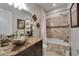 Charming bathroom showcasing a granite countertop vanity with a modern, sleek vessel sink at 13102 Done Groven Dr, Dover, FL 33527