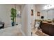 Half bathroom with modern vanity, decorative mirror, and contemporary fixtures at 13102 Done Groven Dr, Dover, FL 33527