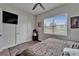Inviting bedroom featuring natural light, neutral tones, and ample space at 13102 Done Groven Dr, Dover, FL 33527