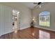 Bedroom with hardwood floors and a view into the kitchen at 13102 Done Groven Dr, Dover, FL 33527