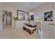 Tastefully decorated dining room with modern lighting, stylish furniture, and contemporary artwork at 13102 Done Groven Dr, Dover, FL 33527