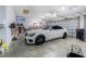 Car parked in a spacious three car garage at 13102 Done Groven Dr, Dover, FL 33527