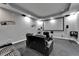 Luxurious home theater featuring leather seating, a projector screen, and ambient lighting for immersive entertainment at 13102 Done Groven Dr, Dover, FL 33527