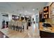 Open kitchen features granite counters, stainless appliances, a center island with seating, and wine storage at 13102 Done Groven Dr, Dover, FL 33527