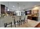 A gourmet kitchen showcasing dark wood cabinets, granite countertops, and a tiled backsplash at 13102 Done Groven Dr, Dover, FL 33527