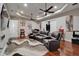 Spacious living room with a large sofa, recessed lighting, and stylish décor for relaxation and entertainment at 13102 Done Groven Dr, Dover, FL 33527