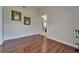 Inviting living room with wood floors, neutral walls, and elegant decor offers a warm, welcoming atmosphere at 13102 Done Groven Dr, Dover, FL 33527