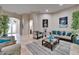 Spacious living room with sofas, arched doorways, and stylish artwork, providing a welcoming atmosphere at 13102 Done Groven Dr, Dover, FL 33527