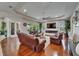 Bright living room with hardwood floors, a fireplace, and comfortable seating, perfect for entertaining at 13102 Done Groven Dr, Dover, FL 33527