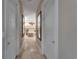 Hallway view of main bathroom featuring a luxurious tub and elegant design at 13102 Done Groven Dr, Dover, FL 33527