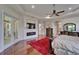 The main bedroom has hardwood floors, recessed lights, ceiling fan, access to a patio and an attached bathroom at 13102 Done Groven Dr, Dover, FL 33527