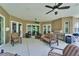Expansive covered outdoor patio perfect for entertaining with ceiling fans and grilling setup at 13102 Done Groven Dr, Dover, FL 33527