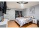 Main bedroom featuring a modern closet, ceiling fan, and monogrammed wall decor at 15906 Country Farm Pl, Tampa, FL 33624