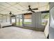 Enclosed sunroom with ceiling fans, ample natural light and backyard views at 15906 Country Farm Pl, Tampa, FL 33624