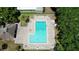 Aerial shot of the community pool with plenty of lounge chairs and tables for residents to enjoy at 1600 Amberlea N Dr, Dunedin, FL 34698