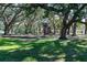 Spacious playground with mature trees providing shade, creating a fun and inviting outdoor space for residents at 1600 Amberlea N Dr, Dunedin, FL 34698