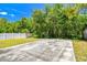 A backyard that's enclosed by a white fence at 16138 Manorwood Cir, Tampa, FL 33624