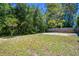 A backyard that's enclosed by a wooden fence at 16138 Manorwood Cir, Tampa, FL 33624