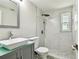 This bathroom features a walk-in shower, modern sink, and a large mirror at 16138 Manorwood Cir, Tampa, FL 33624