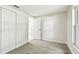 Bright, carpeted bedroom with a double closet at 16138 Manorwood Cir, Tampa, FL 33624