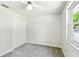 Bedroom features neutral carpet, a closet, and a ceiling fan at 16138 Manorwood Cir, Tampa, FL 33624