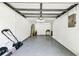 Empty garage with a water heater and access door at 16138 Manorwood Cir, Tampa, FL 33624
