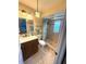 Bathroom featuring a tiled walk-in shower, a new vanity, and stylish fixtures at 1814 Driftwood S Cir, Oldsmar, FL 34677