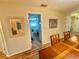 Dining room with wood table and view to bedroom at 1814 Driftwood S Cir, Oldsmar, FL 34677