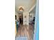 Inviting entryway featuring wood-look flooring and an open view to the living spaces at 1814 Driftwood S Cir, Oldsmar, FL 34677