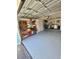 Functional garage space with built-in storage, a workbench, and a utility area with washer and dryer at 1814 Driftwood S Cir, Oldsmar, FL 34677