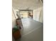 Spacious garage with ample storage cabinets and a workbench, perfect for projects and organization at 1814 Driftwood S Cir, Oldsmar, FL 34677