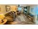 Inviting living room features a comfortable sectional sofa, accent chair, and stylish decor for relaxation and entertainment at 1814 Driftwood S Cir, Oldsmar, FL 34677