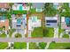 An aerial view showcases the house's proximity to neighbors and its private backyard pool at 1848 68Th N Ave, St Petersburg, FL 33702