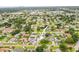 Aerial view of property surrounded by mature trees and landscaping at 1848 68Th N Ave, St Petersburg, FL 33702