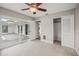 Bedroom with neutral walls and carpet, slider to backyard, and ceiling fan at 1848 68Th N Ave, St Petersburg, FL 33702