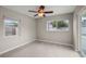 Bedroom with neutral walls and carpet, ceiling fan and natural light at 1848 68Th N Ave, St Petersburg, FL 33702