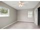 Bright bedroom with two windows and ceiling fan, providing lots of light at 1848 68Th N Ave, St Petersburg, FL 33702