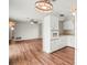A view of the open kitchen with updated appliances and wood floors at 1848 68Th N Ave, St Petersburg, FL 33702