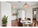 The staged kitchen features white appliances and a breakfast nook at 1848 68Th N Ave, St Petersburg, FL 33702