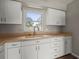 Kitchen with double basin sink, ample cabinet space, and a large window at 1848 68Th N Ave, St Petersburg, FL 33702